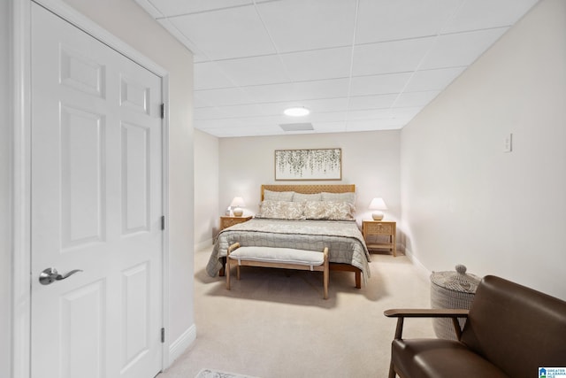 bedroom with baseboards and carpet