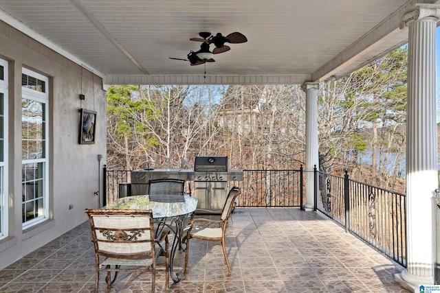 view of patio / terrace featuring outdoor dining space and a ceiling fan