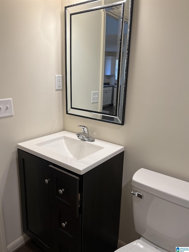 bathroom with vanity and toilet