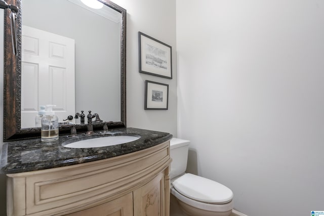 bathroom with toilet and vanity