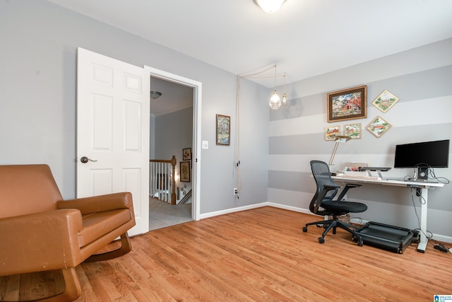 office space featuring light wood-type flooring and baseboards