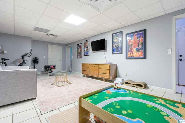 rec room featuring light tile patterned floors, a drop ceiling, baseboards, and visible vents