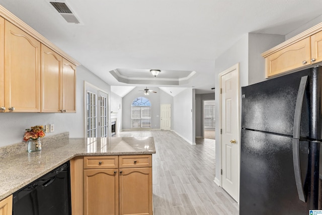 kitchen with visible vents, black appliances, light brown cabinets, a peninsula, and a raised ceiling