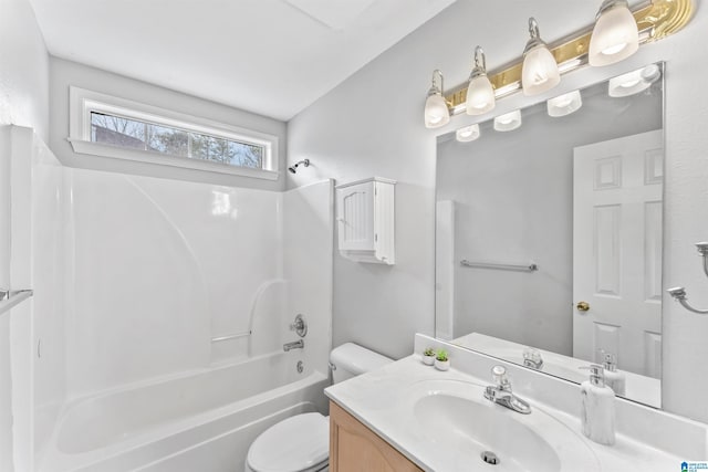 bathroom with vanity, toilet, and shower / washtub combination