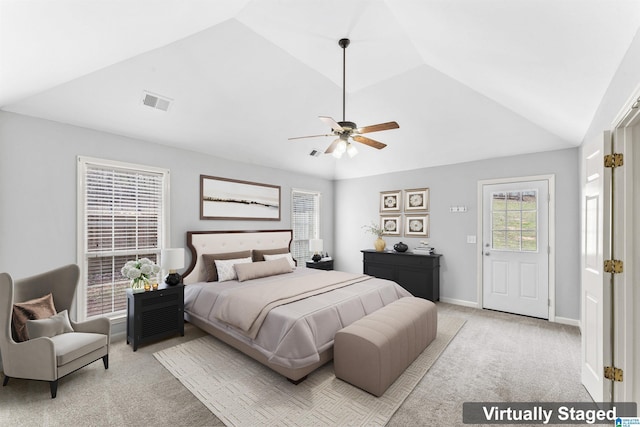 bedroom featuring visible vents, baseboards, ceiling fan, light colored carpet, and lofted ceiling