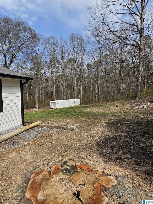 view of yard featuring a view of trees