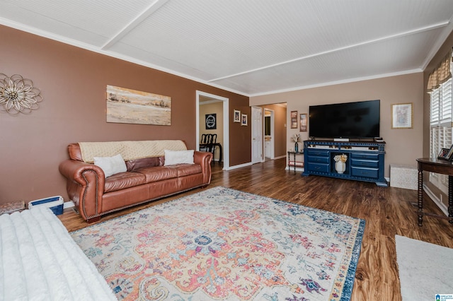 living room with crown molding, dark wood-type flooring, and baseboards