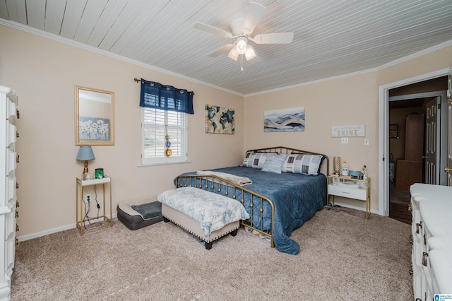 bedroom with crown molding, baseboards, carpet floors, and ceiling fan