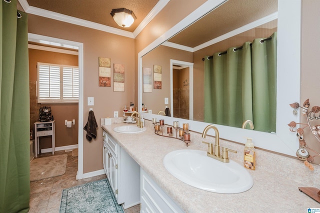 full bathroom with a sink, baseboards, ornamental molding, and double vanity