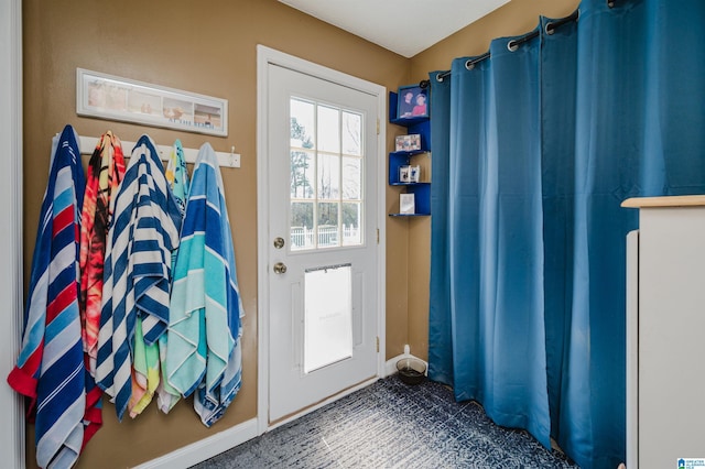 entryway featuring baseboards