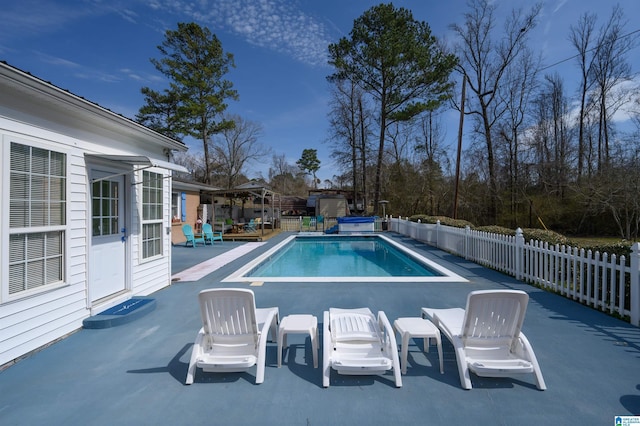 view of pool with a fenced in pool, a patio, a hot tub, and fence