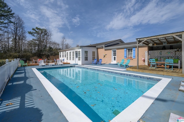 view of swimming pool with a fenced in pool, a patio, a deck, and fence