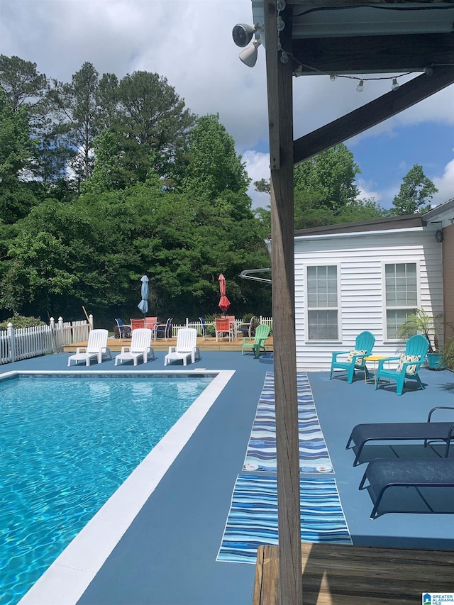 view of pool with a fenced in pool, a patio, and fence