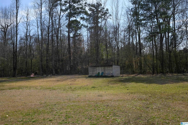 view of yard with a forest view