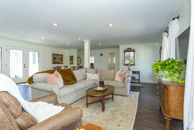 living room with baseboards, ornate columns, recessed lighting, ornamental molding, and dark wood-type flooring