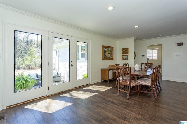 dining space featuring crown molding, baseboards, dark wood finished floors, recessed lighting, and french doors