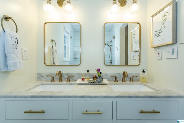 bathroom featuring a sink and double vanity