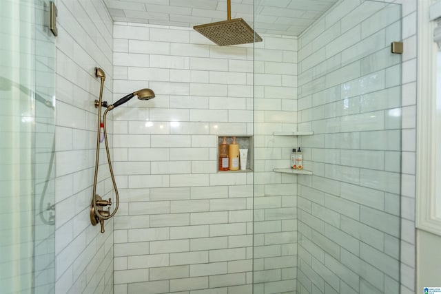 bathroom with a tile shower