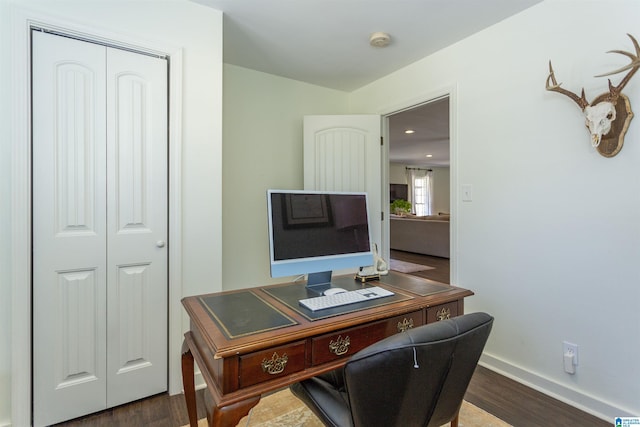 office area featuring baseboards and wood finished floors