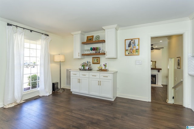 bar featuring a brick fireplace, dark wood-style floors, and ornamental molding