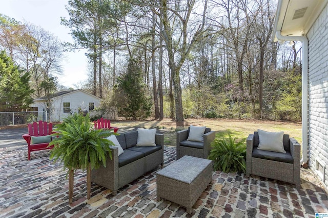 view of patio with an outdoor hangout area and fence