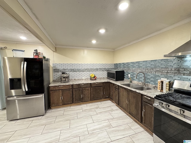 kitchen featuring dark brown cabinets, appliances with stainless steel finishes, ornamental molding, and a sink