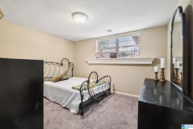 bedroom featuring carpet flooring and baseboards