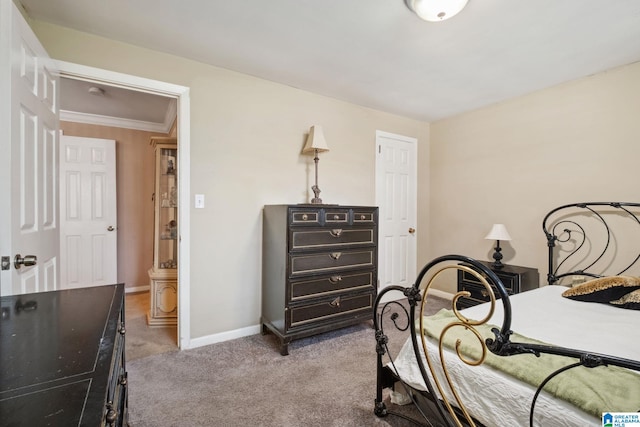 bedroom featuring baseboards, carpet floors, and ornamental molding