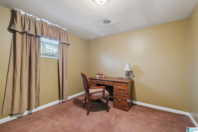 carpeted home office featuring baseboards