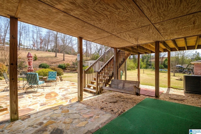 view of patio / terrace featuring stairs