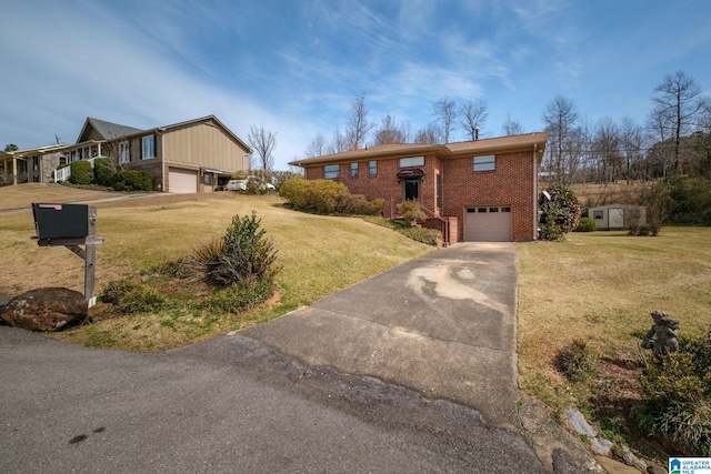 view of front of house featuring brick siding, driveway, an attached garage, and a front lawn