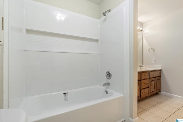 bathroom with tile patterned flooring, tub / shower combination, vanity, and baseboards