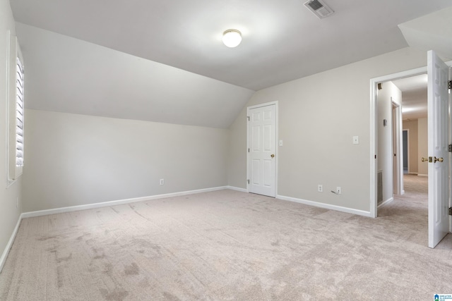 bonus room with baseboards, visible vents, carpet floors, and lofted ceiling