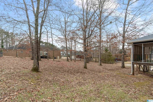 view of yard featuring a sunroom