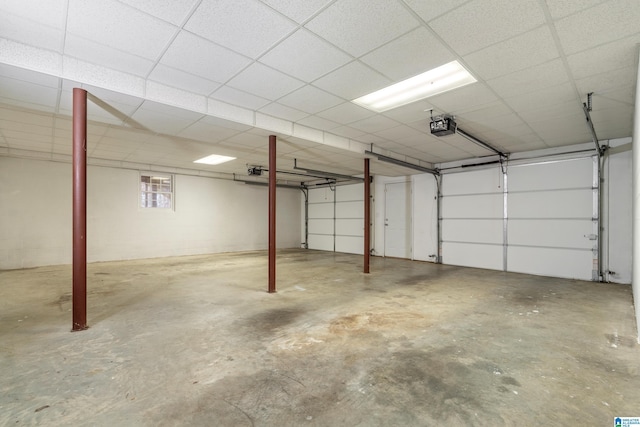 parking garage with concrete block wall and a garage door opener