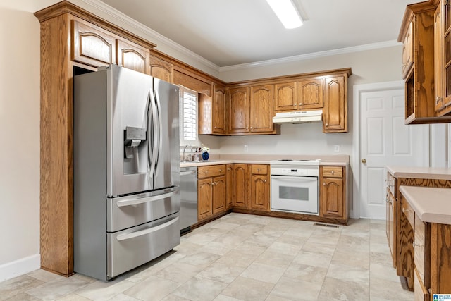 kitchen featuring under cabinet range hood, crown molding, brown cabinetry, and appliances with stainless steel finishes