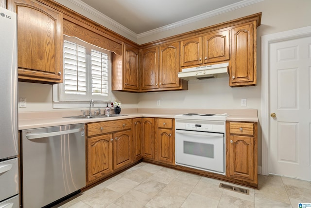 kitchen with under cabinet range hood, visible vents, brown cabinets, and appliances with stainless steel finishes