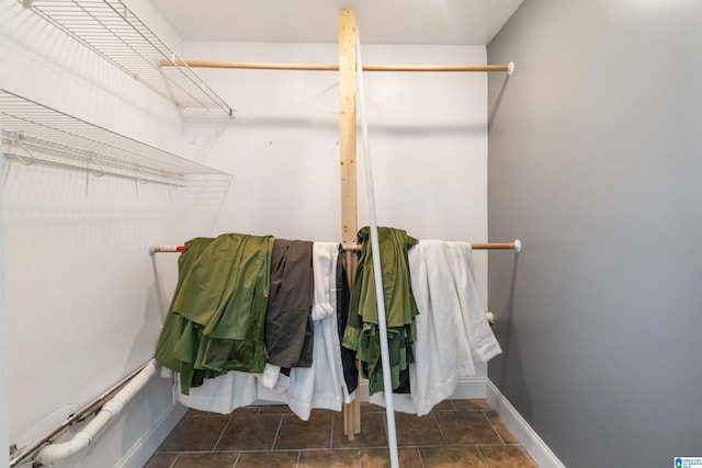 interior space featuring tile patterned floors and baseboards