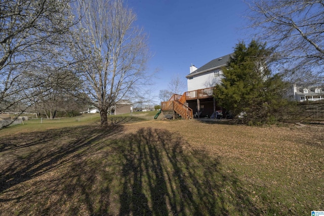 view of yard featuring stairs and a deck