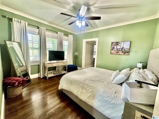 bedroom featuring a ceiling fan, wood finished floors, baseboards, and ornamental molding