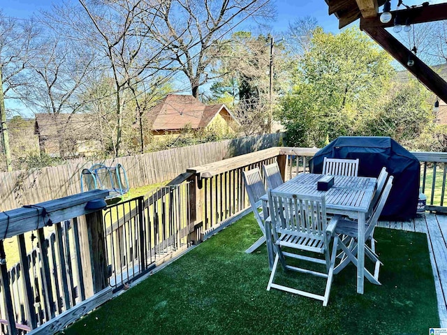 view of yard with a wooden deck and a fenced backyard