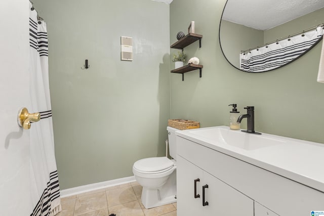 full bathroom with vanity, baseboards, a textured ceiling, tile patterned floors, and toilet