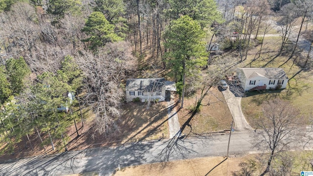 birds eye view of property with a wooded view