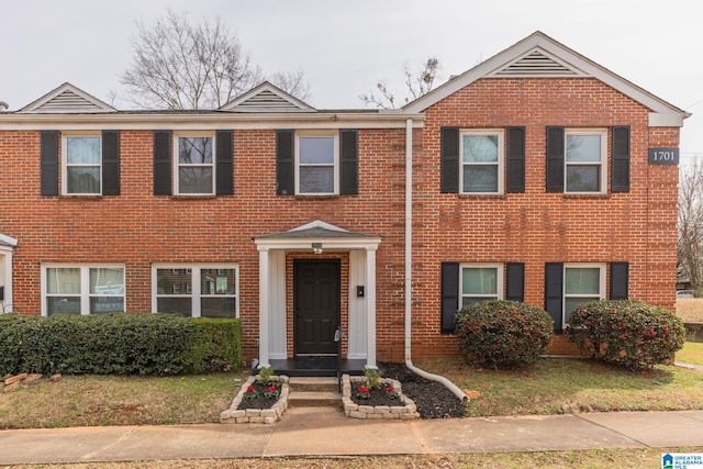 view of front of home featuring brick siding