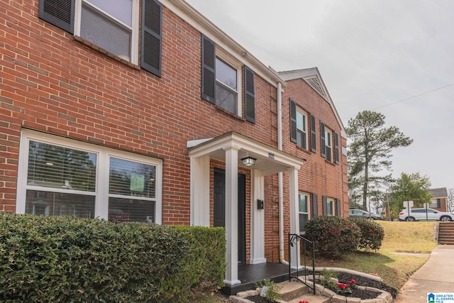 view of front of home with brick siding