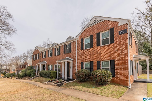 view of front of property with brick siding and a residential view