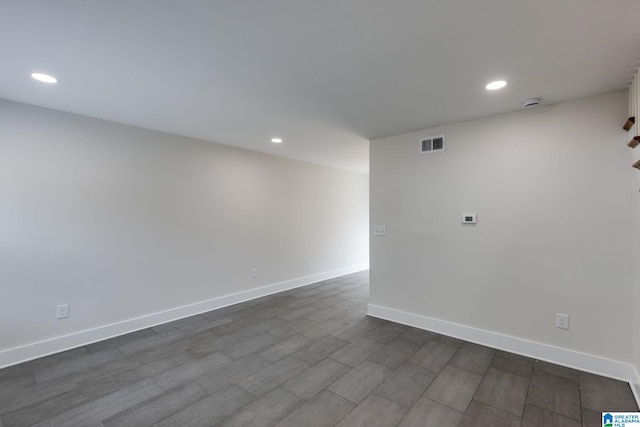 unfurnished room featuring recessed lighting, baseboards, and visible vents