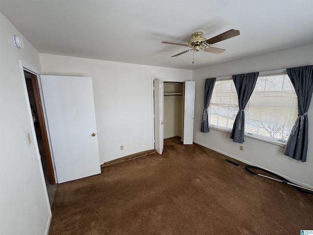 unfurnished bedroom with visible vents, baseboards, carpet floors, a closet, and a ceiling fan