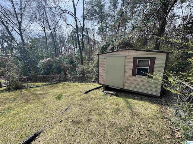 view of shed featuring fence