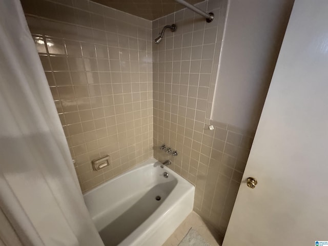 bathroom with shower / bath combo with shower curtain